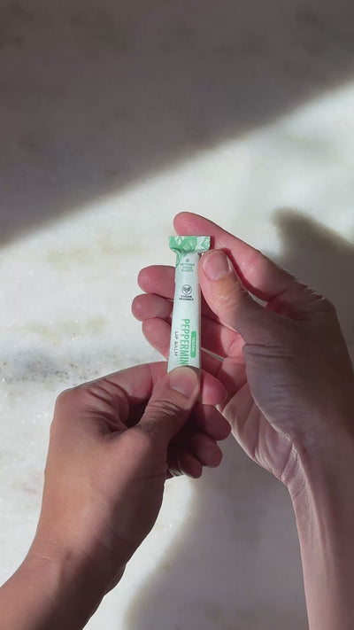 Opening the peppermint All Natural Lip Balm paper tube