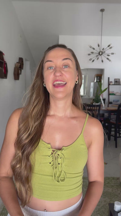 Creator Alexa showing the clean ingredient label on the All Natural Lip Balm paper tube