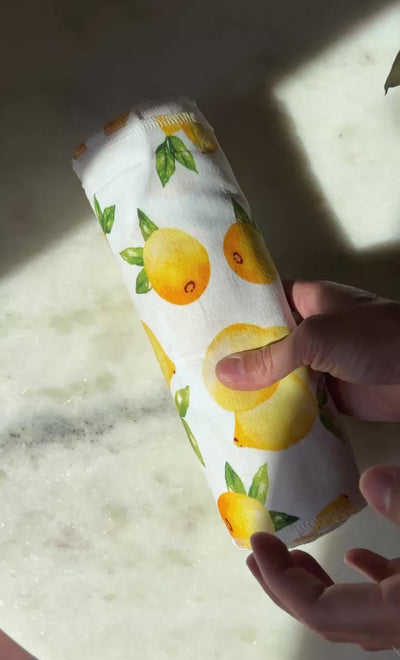 Unrolling a pre-rolled Lemons Reusable Paper Towels roll sheet by sheet