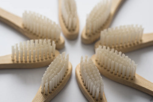 bamboo toothbrushes arranged in a circle