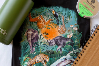 endangered tees shirt, green ceramic reusable bottle, bamboo notebook, and a tin of sunscreen