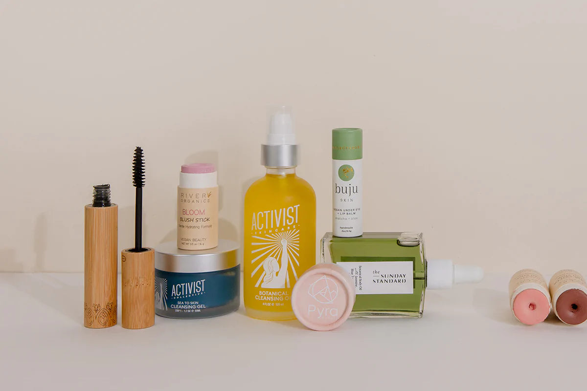 Various sustainable skincare and beauty products arranged on a plain background
