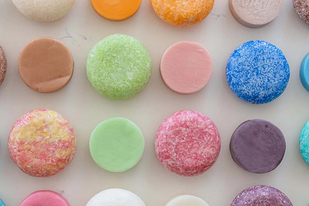 Colorful shampoo and conditioner bars arranged into a grid